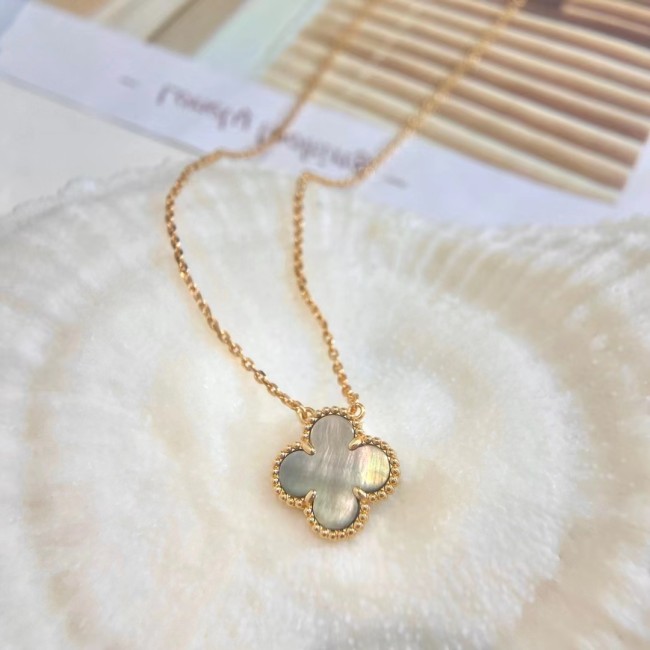 White Fritillaria with four-leaf necklace