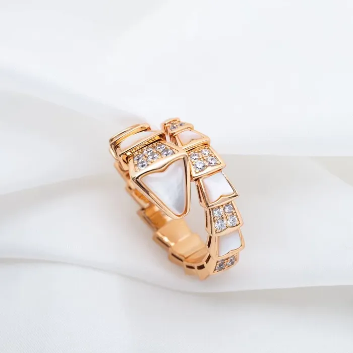 Serpentine diamond ring