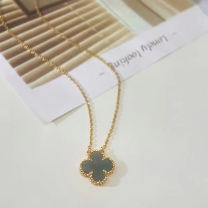 White Fritillaria with four-leaf necklace