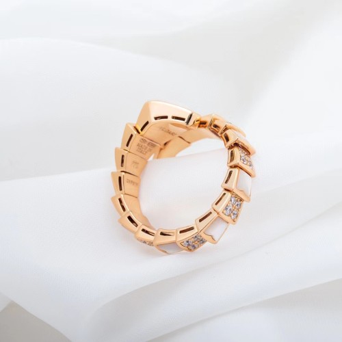 Serpentine diamond ring