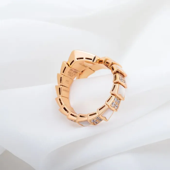 Serpentine diamond ring