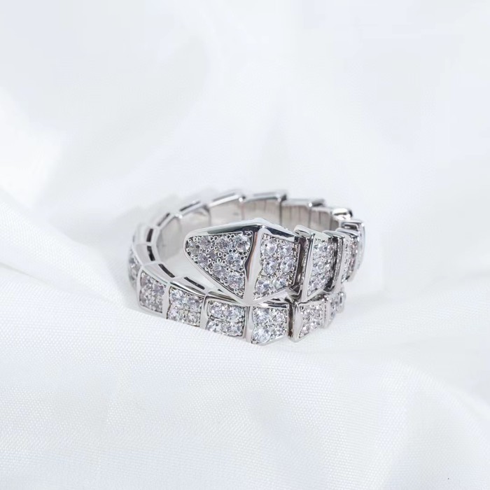Serpentine diamond ring