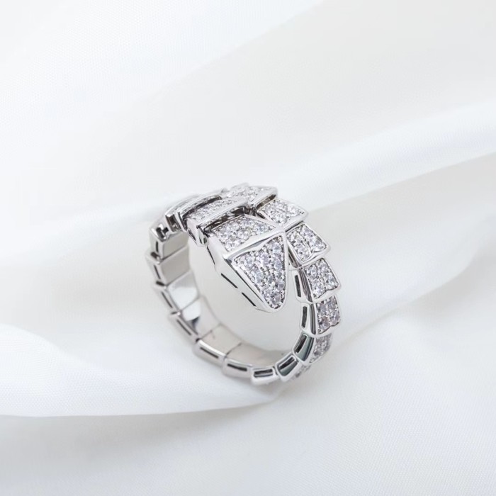 Serpentine diamond ring