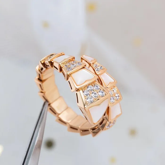 Serpentine diamond ring