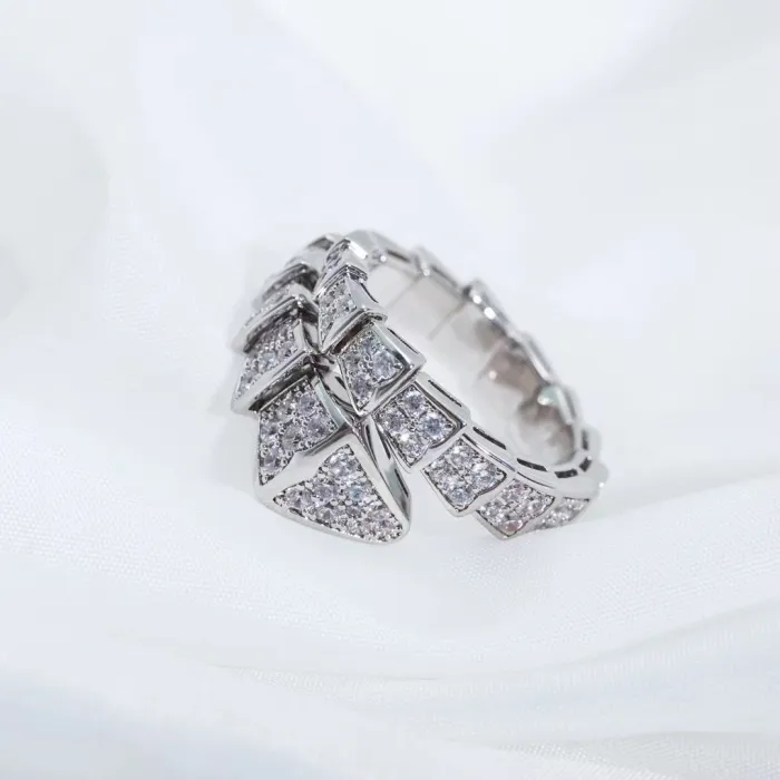 Serpentine diamond ring