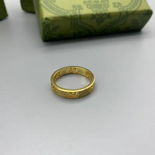 Gold diamond inlaid logo ring