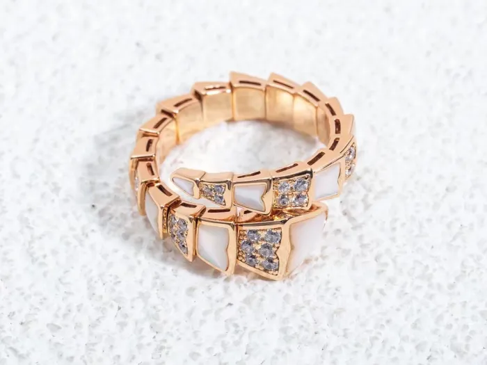 Serpentine diamond ring
