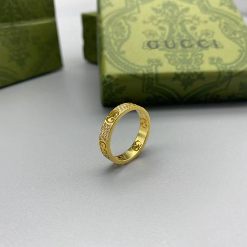 Gold diamond inlaid logo ring