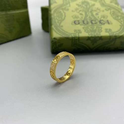 Gold diamond inlaid logo ring