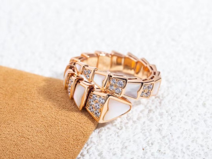 Serpentine diamond ring