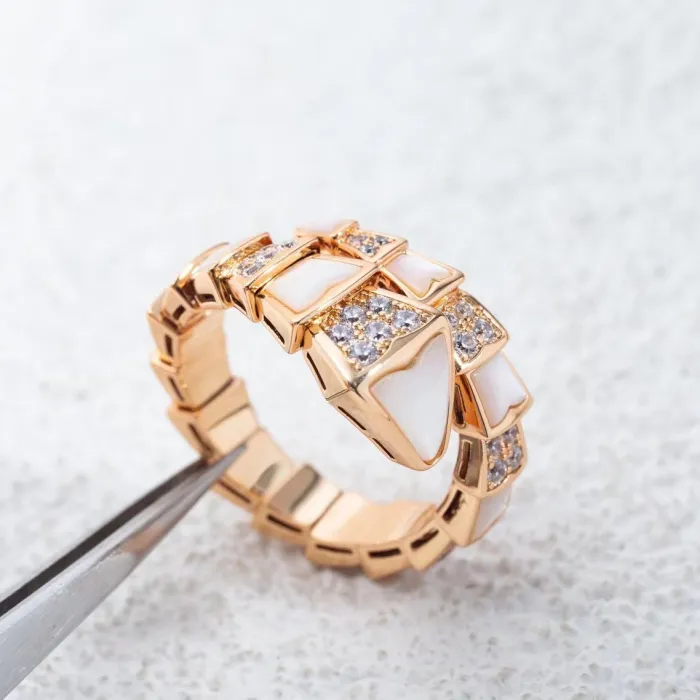 Serpentine diamond ring
