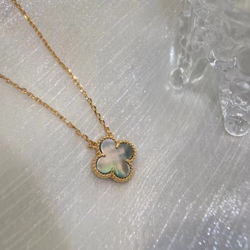 White Fritillaria with four-leaf necklace