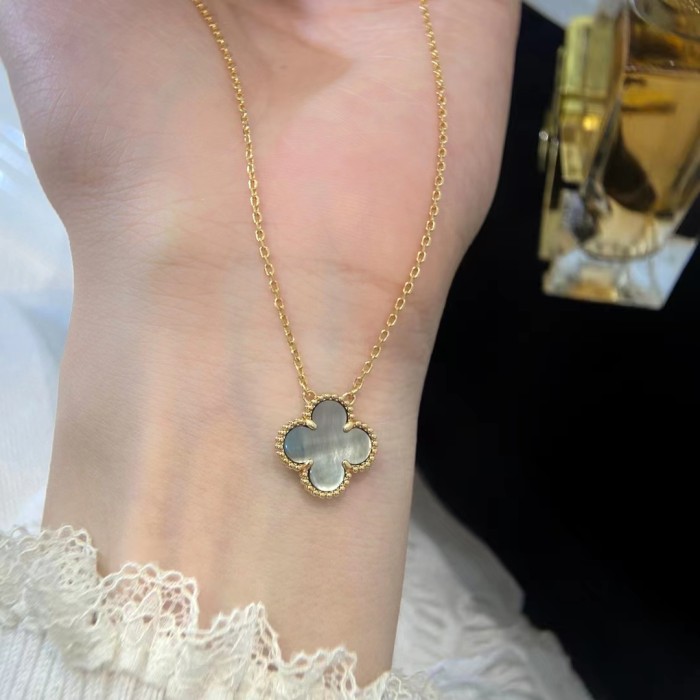 White Fritillaria with four-leaf necklace