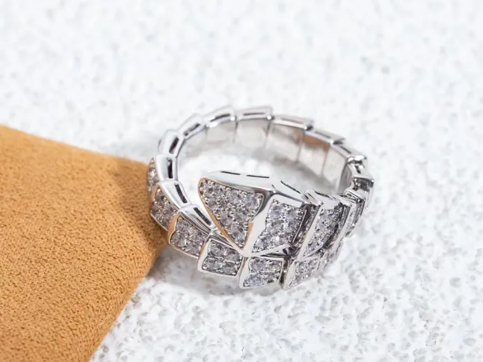 Serpentine diamond ring