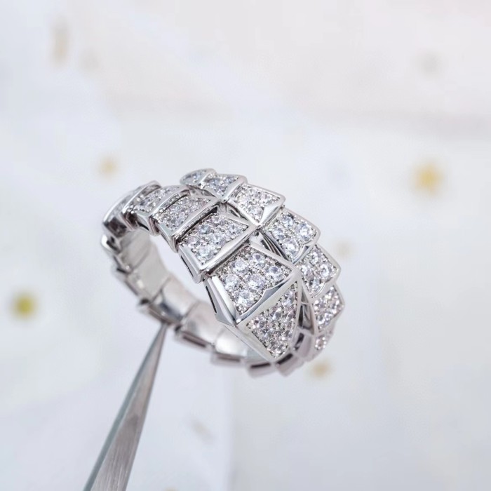 Serpentine diamond ring