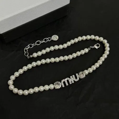 Logo studded with diamonds and pearls necklace