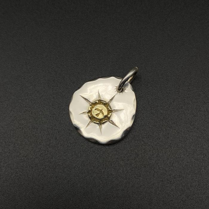 Round gold pendant