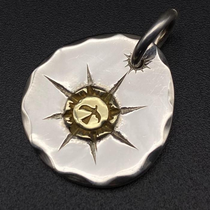 Round gold pendant