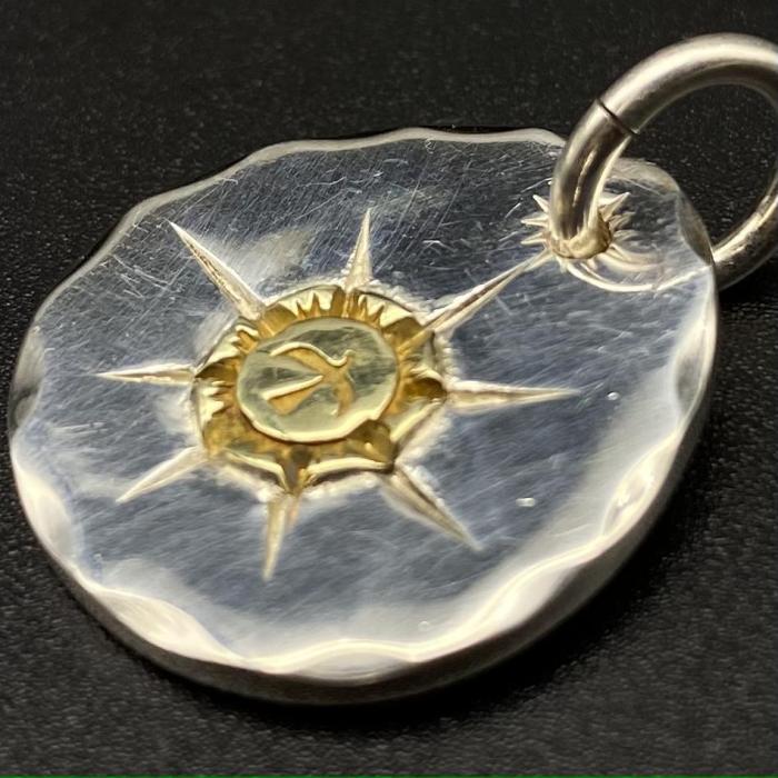 Round gold pendant